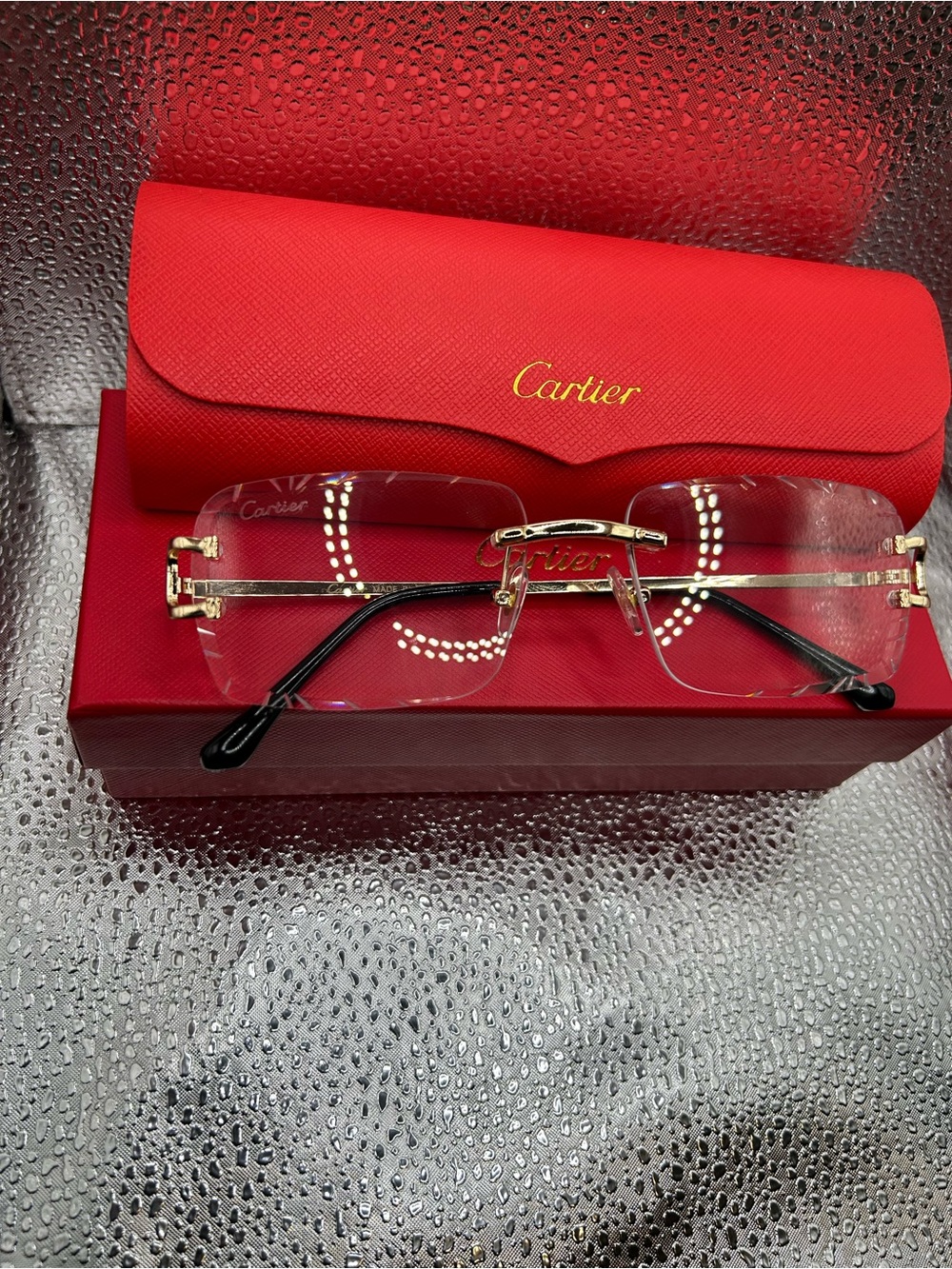 Carti  Gold Rimless Glasses with Black Temples and Red Case